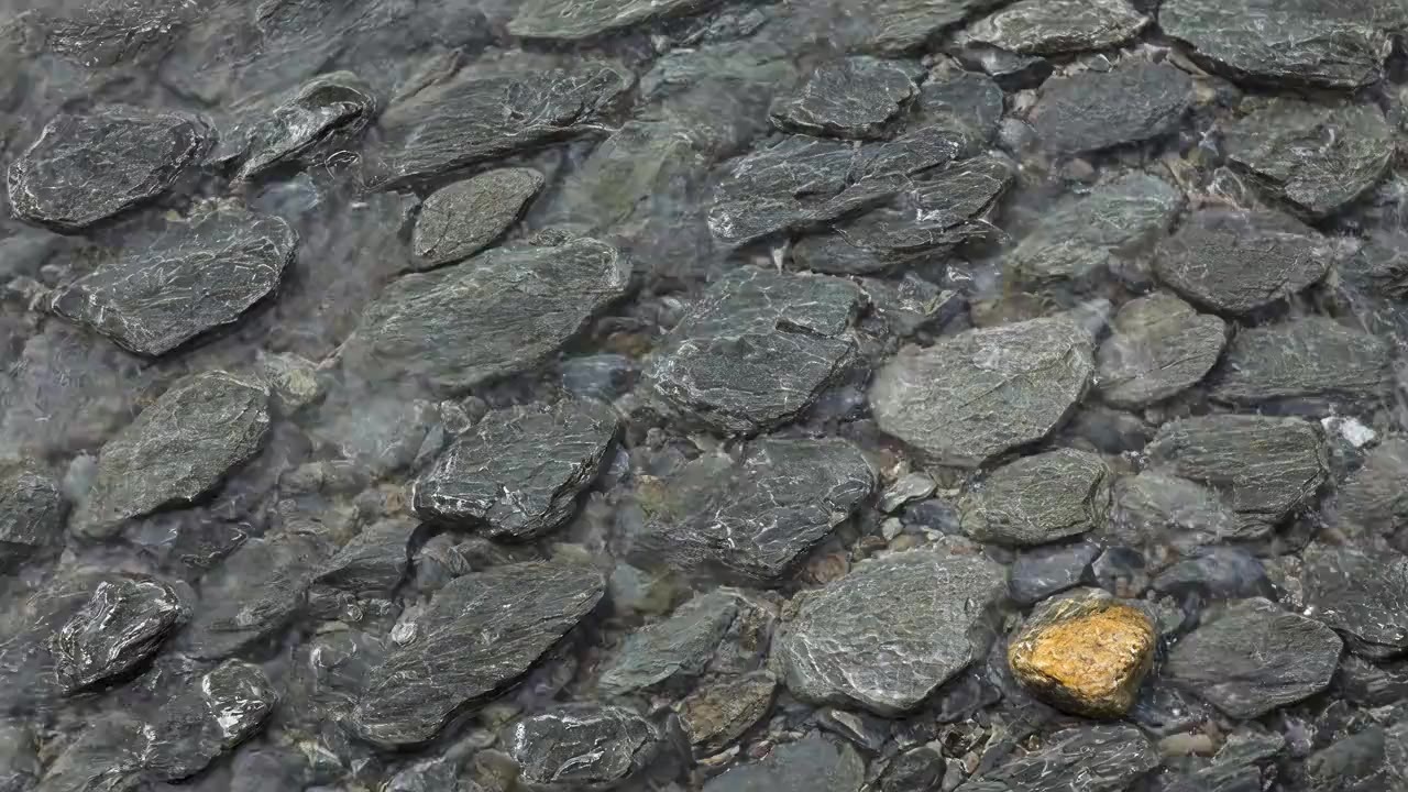 A generated picture of a thin sheet of water running over flat river shingle.